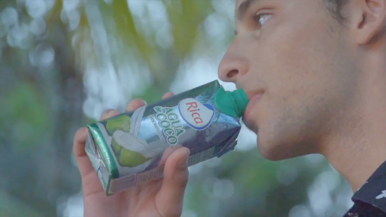 Campaign still from the Grupo Rica Coconut Water launch commercial